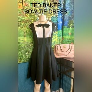 Ted Baker Monochrome Bow Accent Dress has Exposed Full Zipper with Full Lining.